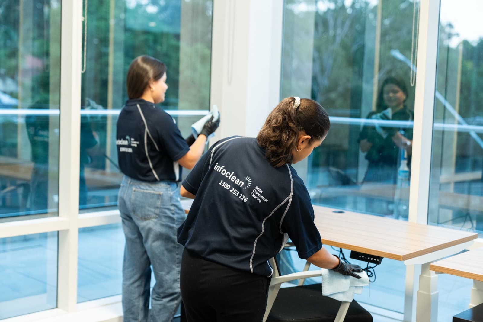 Infoclean cleaners preparing a modern office workspace