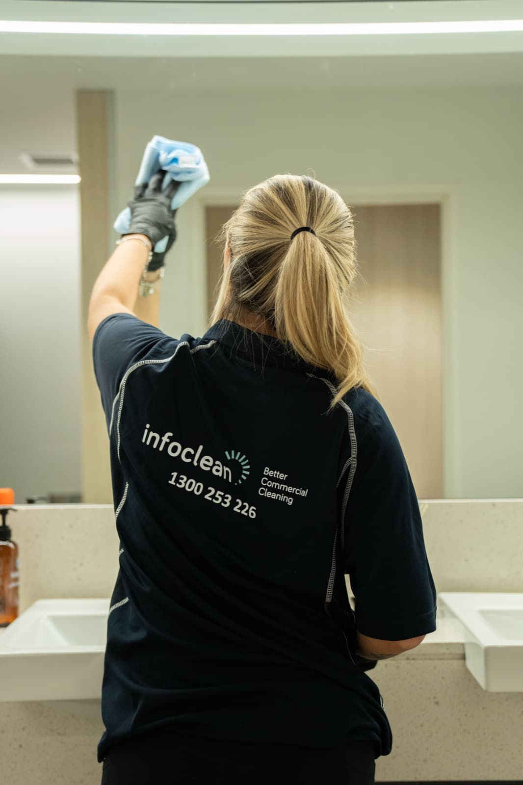 Infoclean cleaner detailing a commercial bathroom